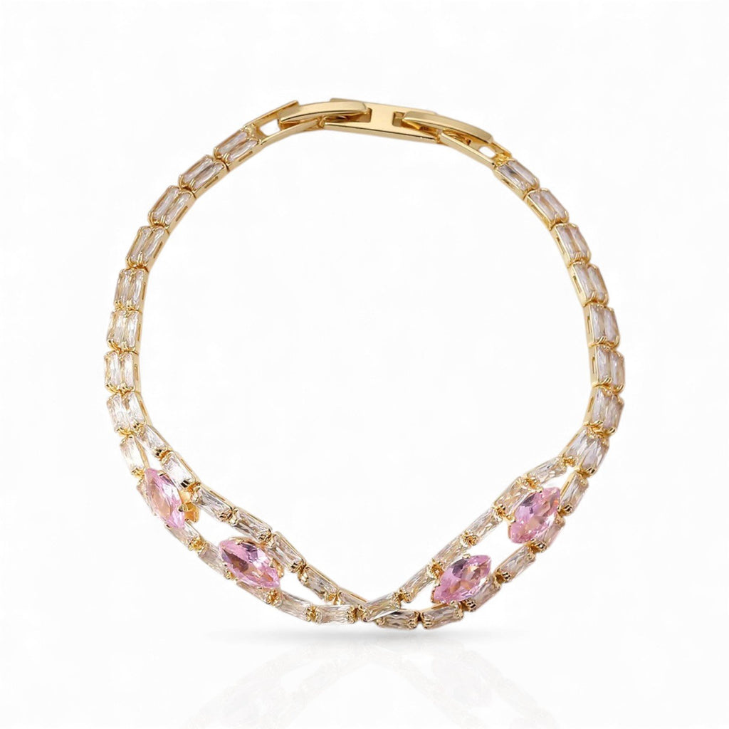 Gold-plated pink zircon bow bracelet on clear background