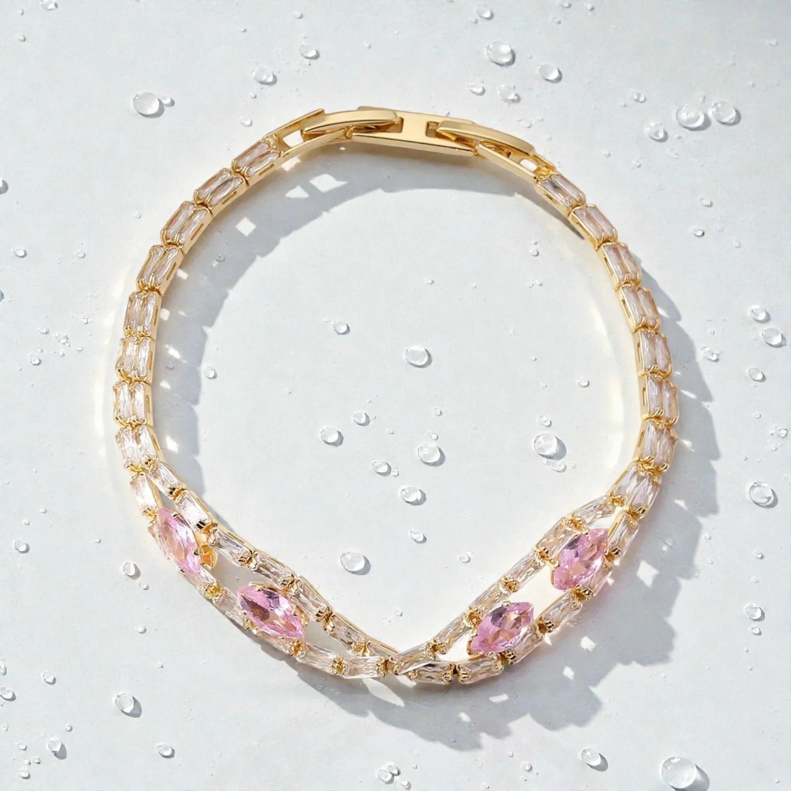 Sparkling pink zircon bow bracelet with light reflections