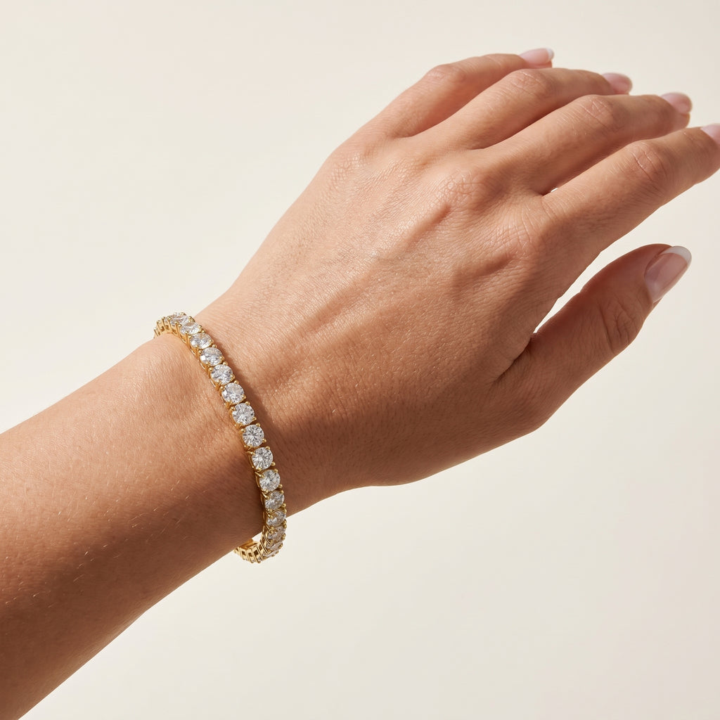 Gold plated tennis bracelet worn on wrist showing sparkle and fit