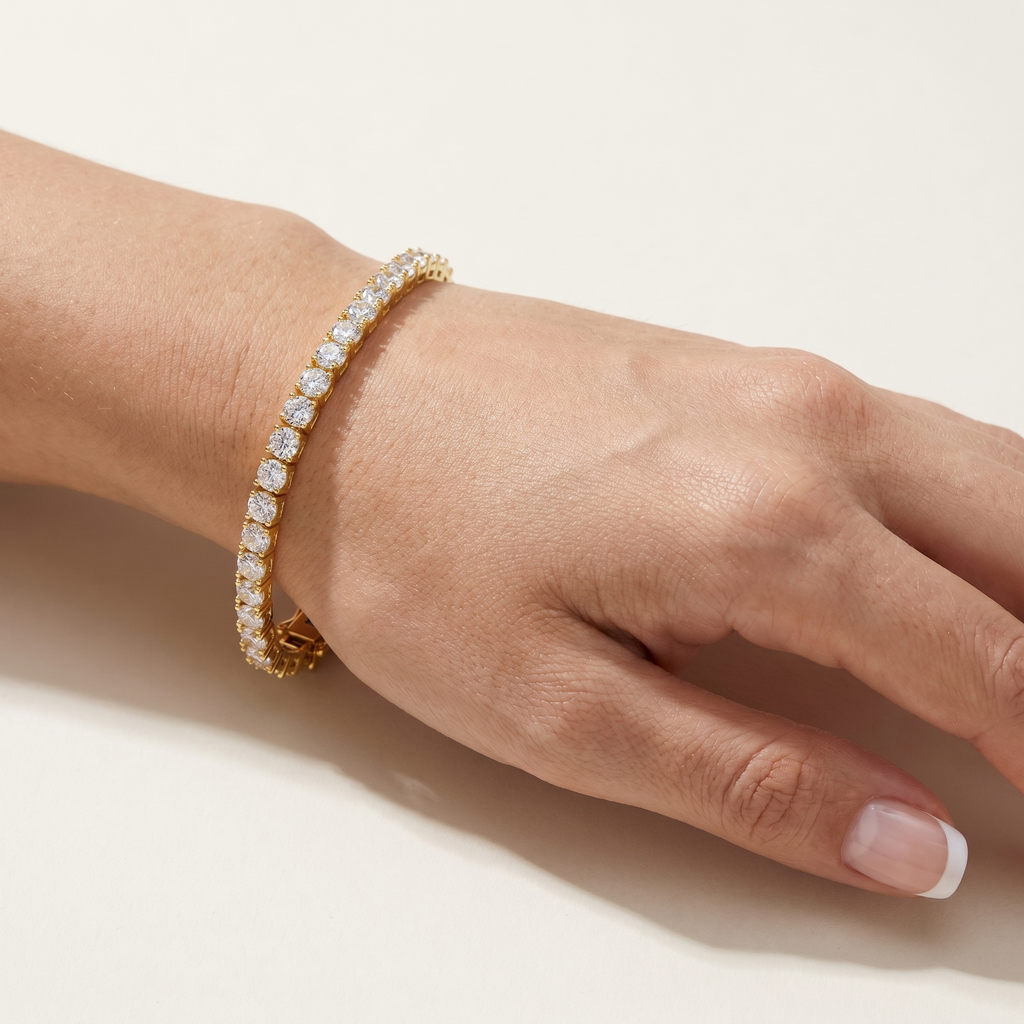 Gold plated tennis bracelet worn on wrist showing sparkle and fit