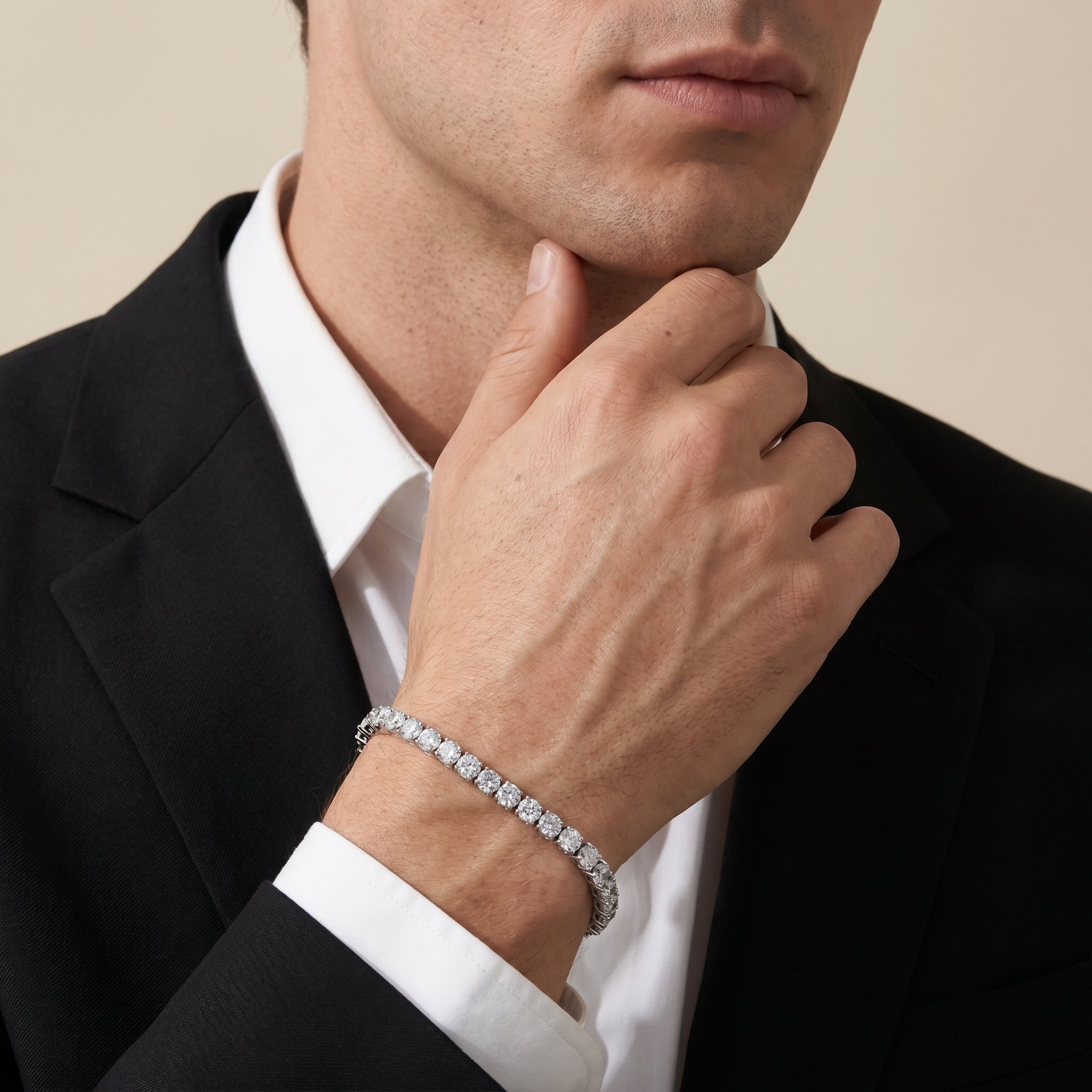 Luxury men's silver tennis bracelet styled with black suit and white shirt